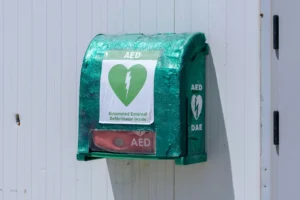 AED outside the pier waiting room container.